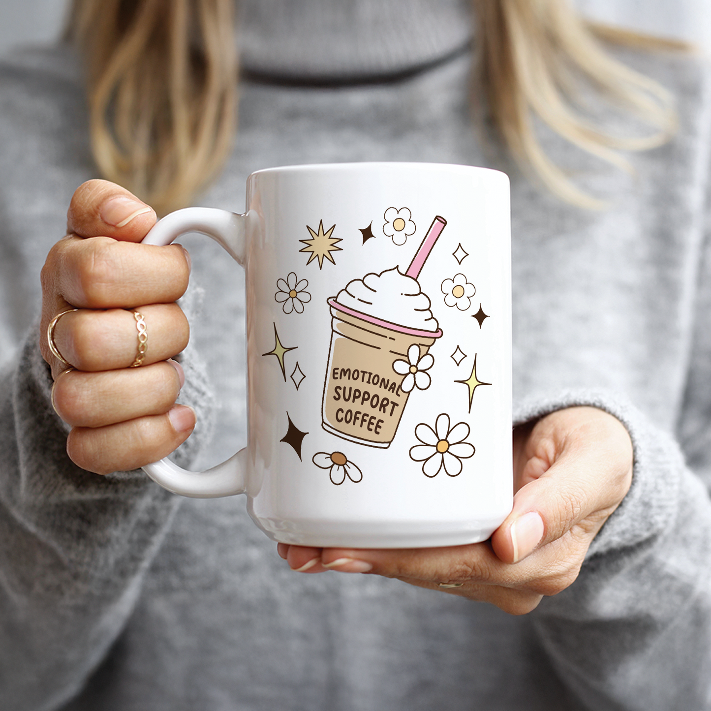 Hand holding 15oz mug with cute iced coffee design