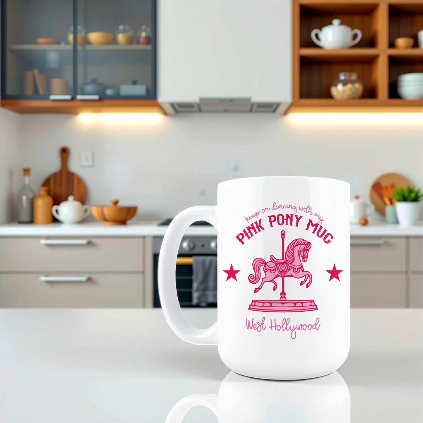 White mug with pink text and design on a kitchen counter