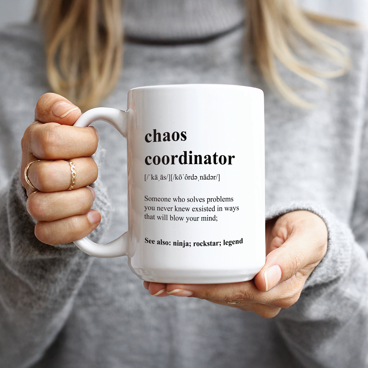 Hand holding Chaos Coordinator dictionary definition design coffee mug