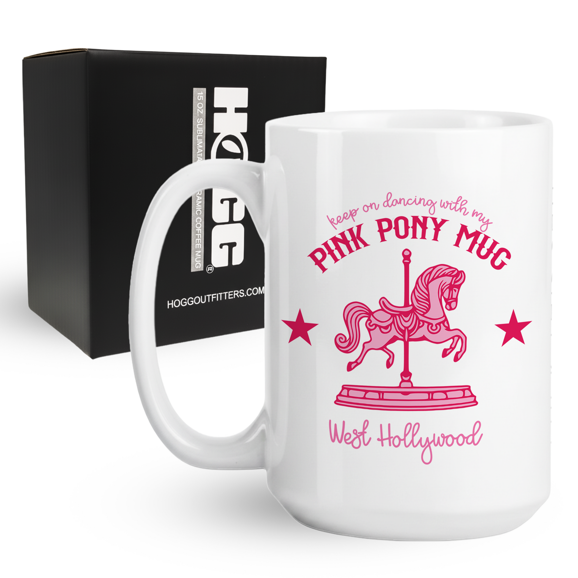 White mug with pink pony design and text, displayed in front of a black box with branding.